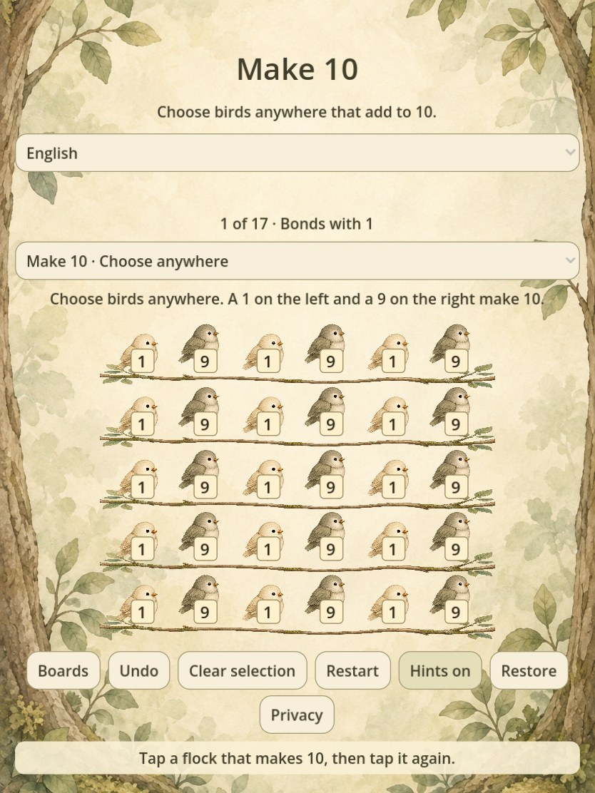 The same Make 10 board on a tablet, framed by woodland trees